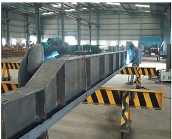 Welding a built-up steel section in the fabrication shop